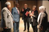 Professors from Britain and Sudan supervise the doctoral exam.