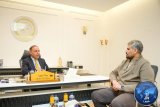 Al-Baour and Thabet discuss the workflow at the Libyan embassy in Cairo.