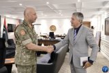 Al-Haddad meets with Serbian ambassador.