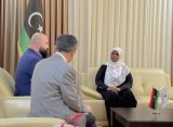 Tughi meets a Turkish delegation.
